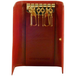 Porte clés de marque SPIRIT en cuir vachette collet rouge.